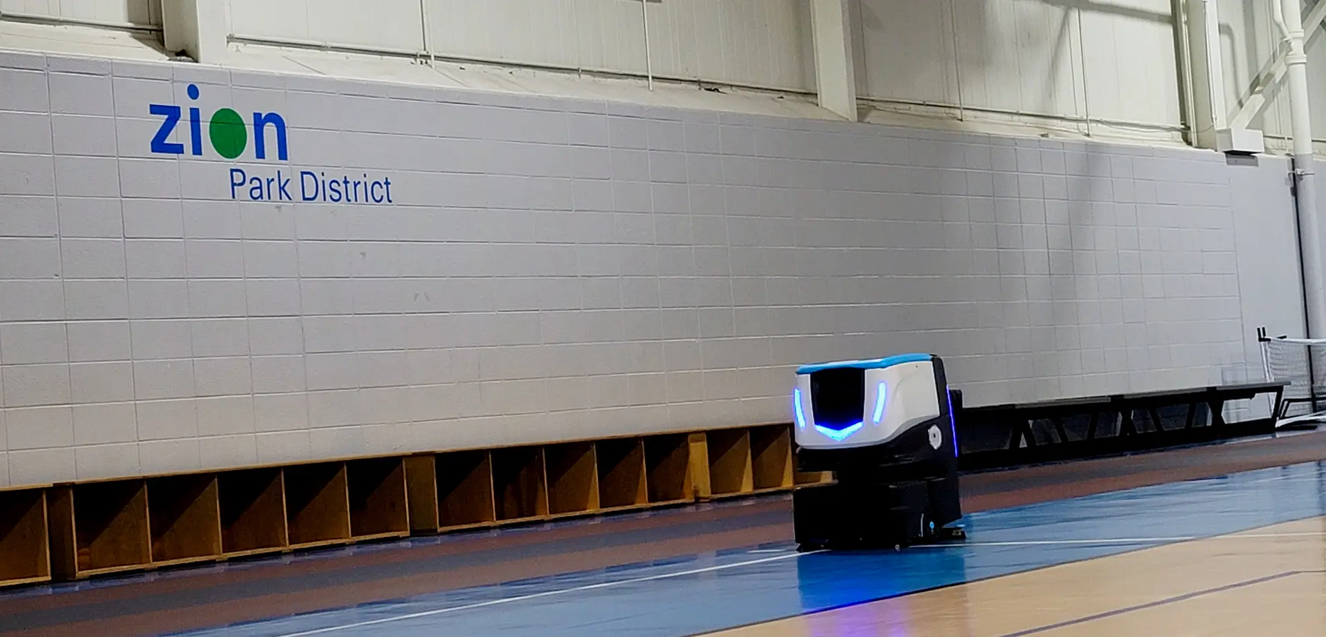 Cobi 18 robotic floor scrubber cleaning gymnasium floor